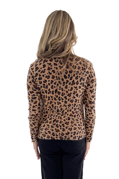 Back view of woman wearing Camel Leopard Crewneck Sweater with jeans against white studio background.