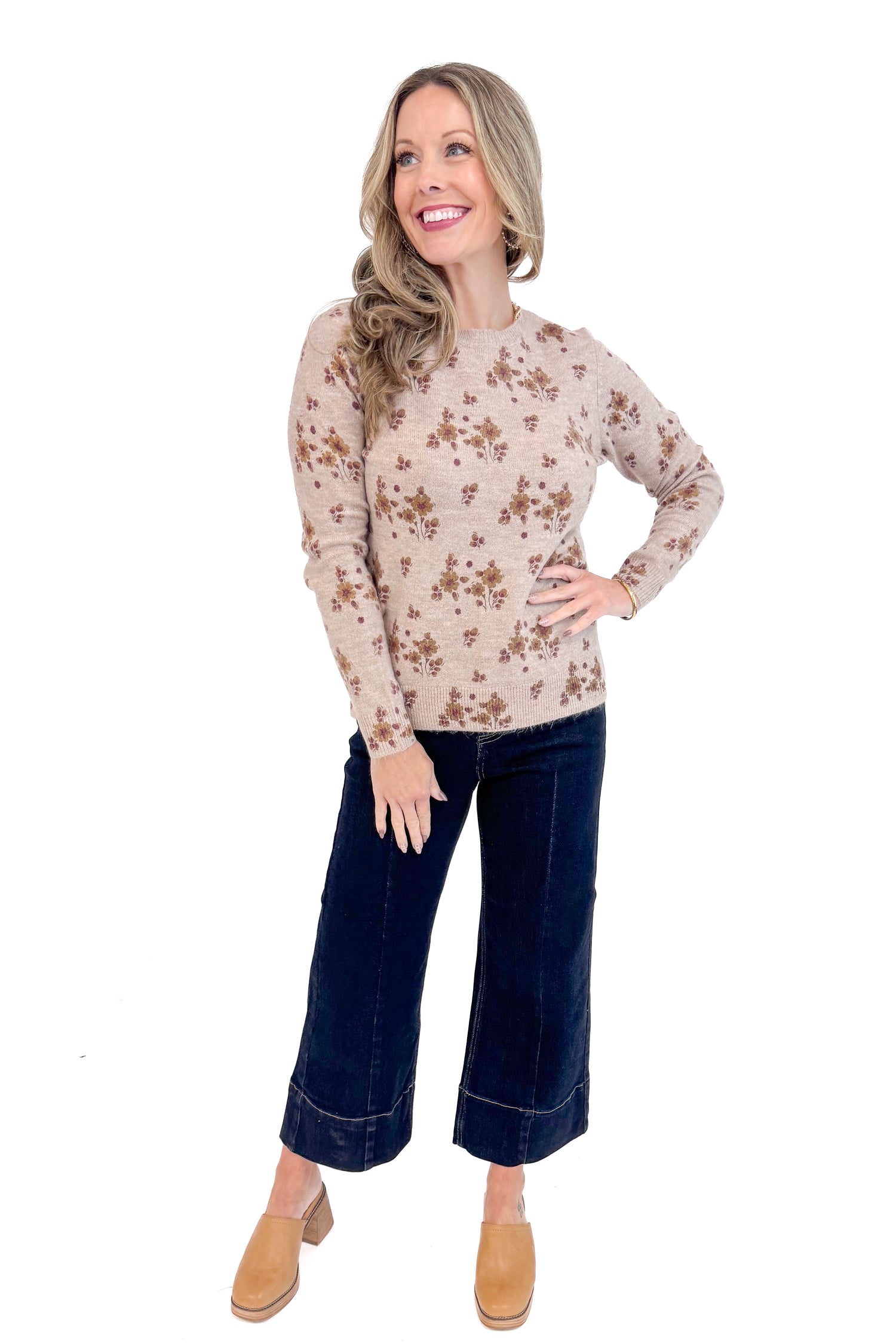 Woman wearing Blush Floral Print Sweater and jeans full length picture.
