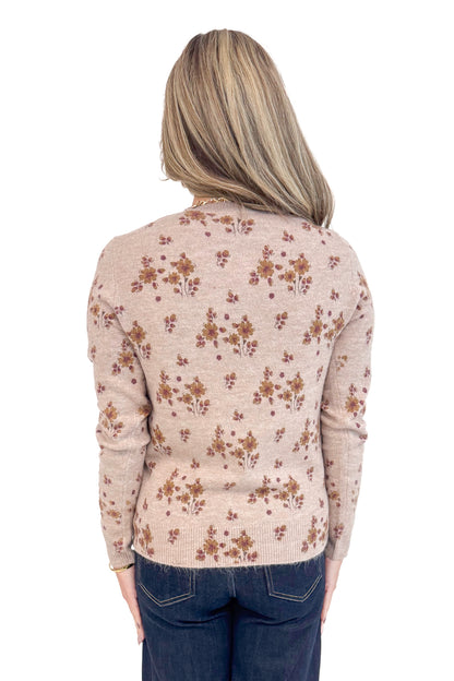 Back view of woman wearing Blush Floral Print Sweater and jeans.