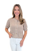 Front view of woman wearing Taupe Faux Stitch Detail Short Sleeve Sweater with jeans against white studio background.