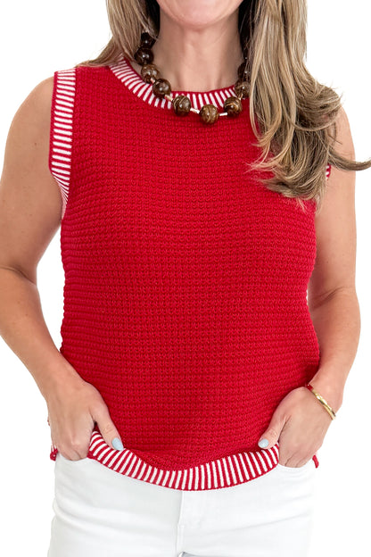 Front detail view of woman wearing Red &amp; White Textured Sweater Tank with jeans against white studio background.