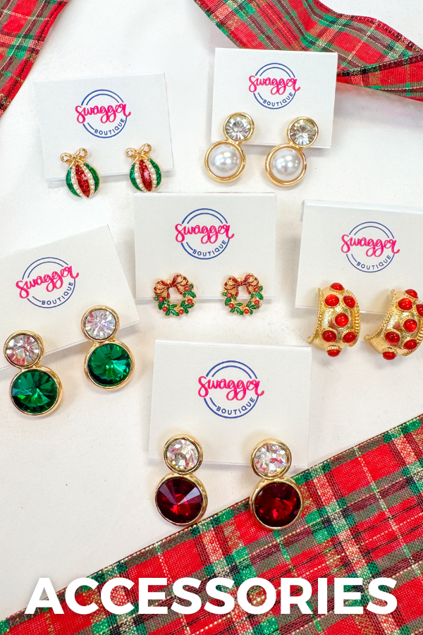 Collection of earrings on display with 'Swagger Accessories' branding against a plaid fabric background.