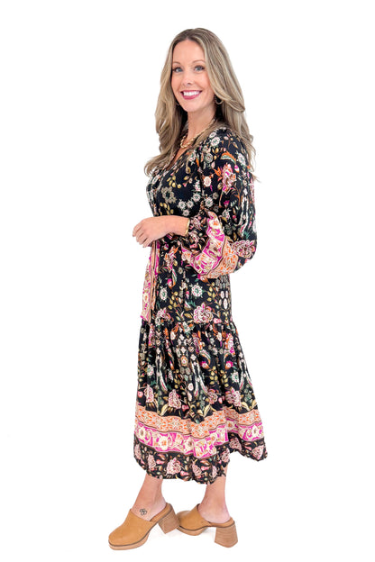 Side view of woman wearing Black &amp; Multi Printed Midi Dress with white studio background.