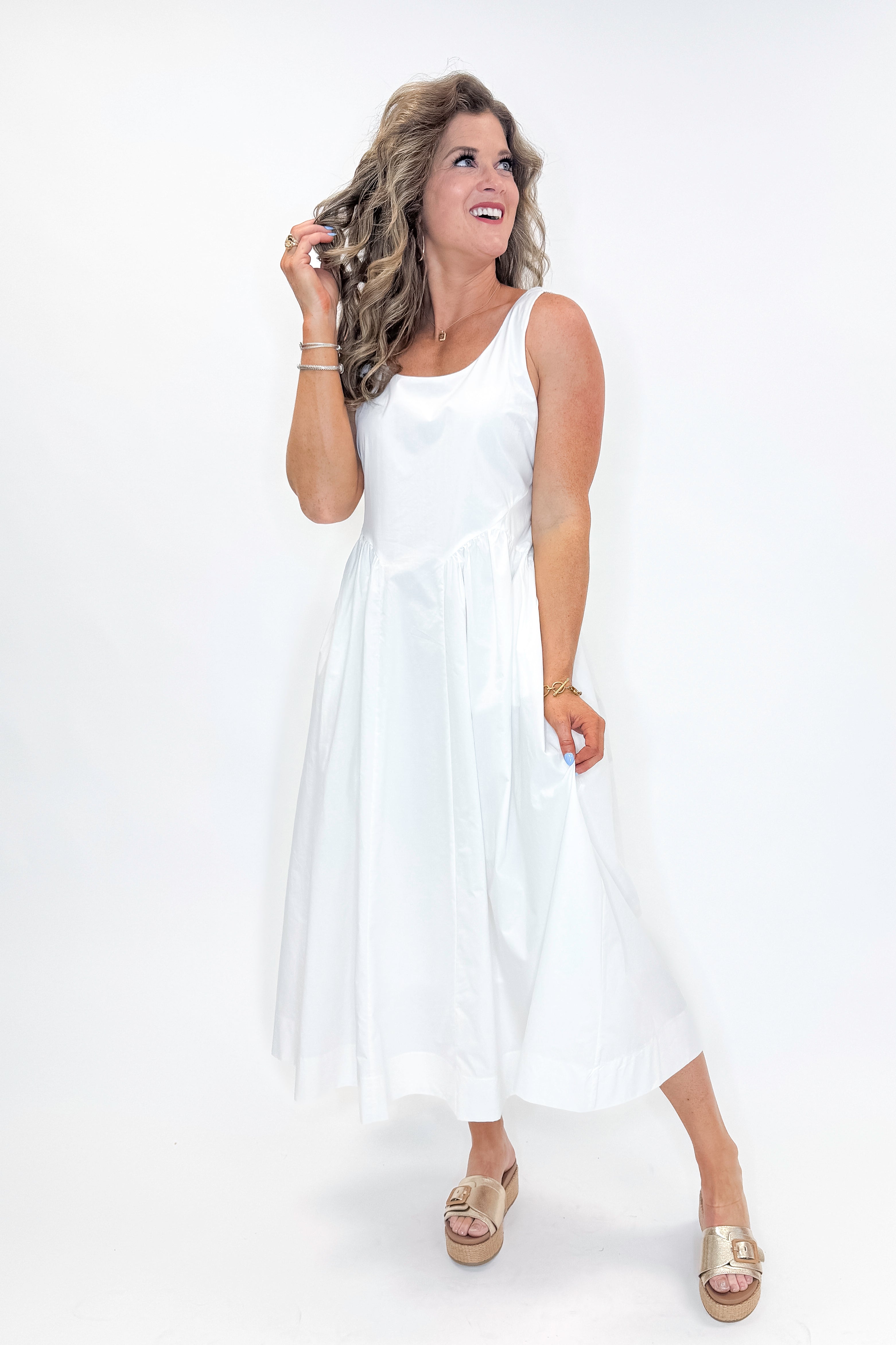 Front view of woman wearing Off White A-Line Midi Dress by PINCH against white studio background.
