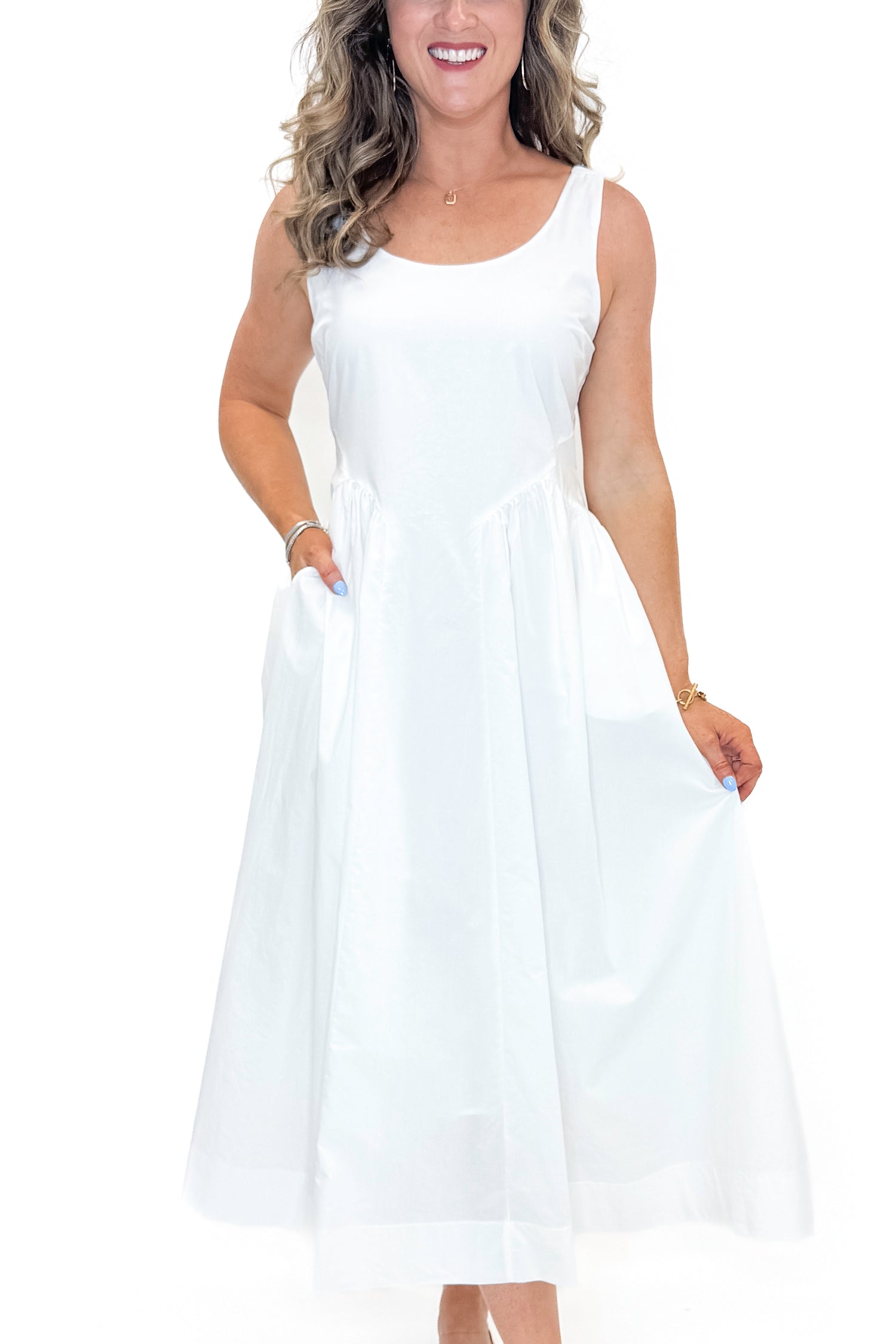 Front detail view of woman wearing Off White A-Line Midi Dress by PINCH against white studio background.