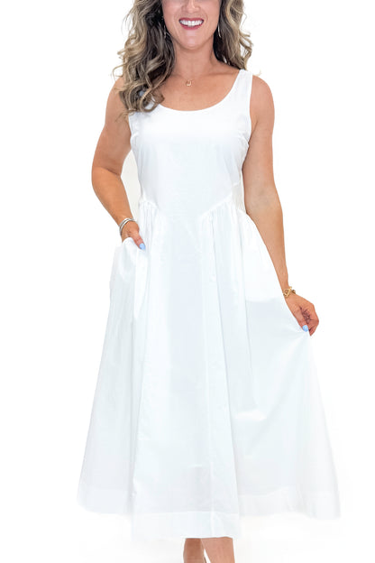 Front detail view of woman wearing Off White A-Line Midi Dress by PINCH against white studio background.
