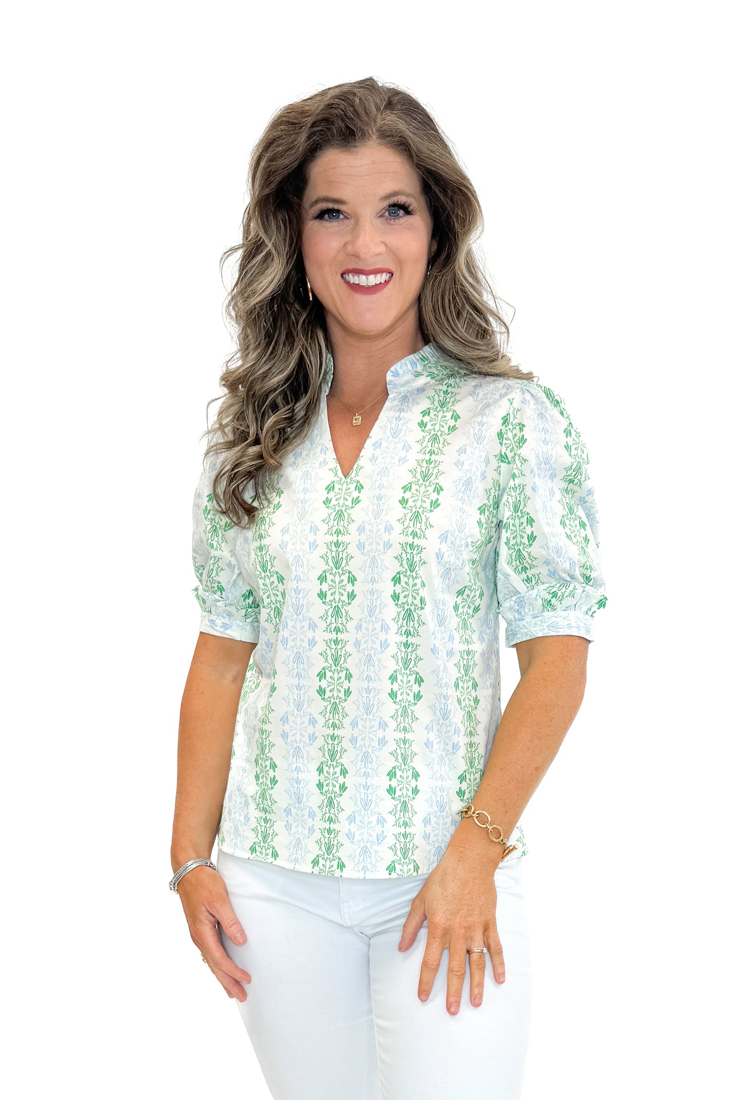Front view of woman wearing Blue &amp; Green Vine Print Colette Top by Mary Square with jeans against white studio background.