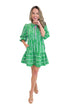 Model wearing Green Garden Lae Riley Mini Dress by Mary Square against white studio background.