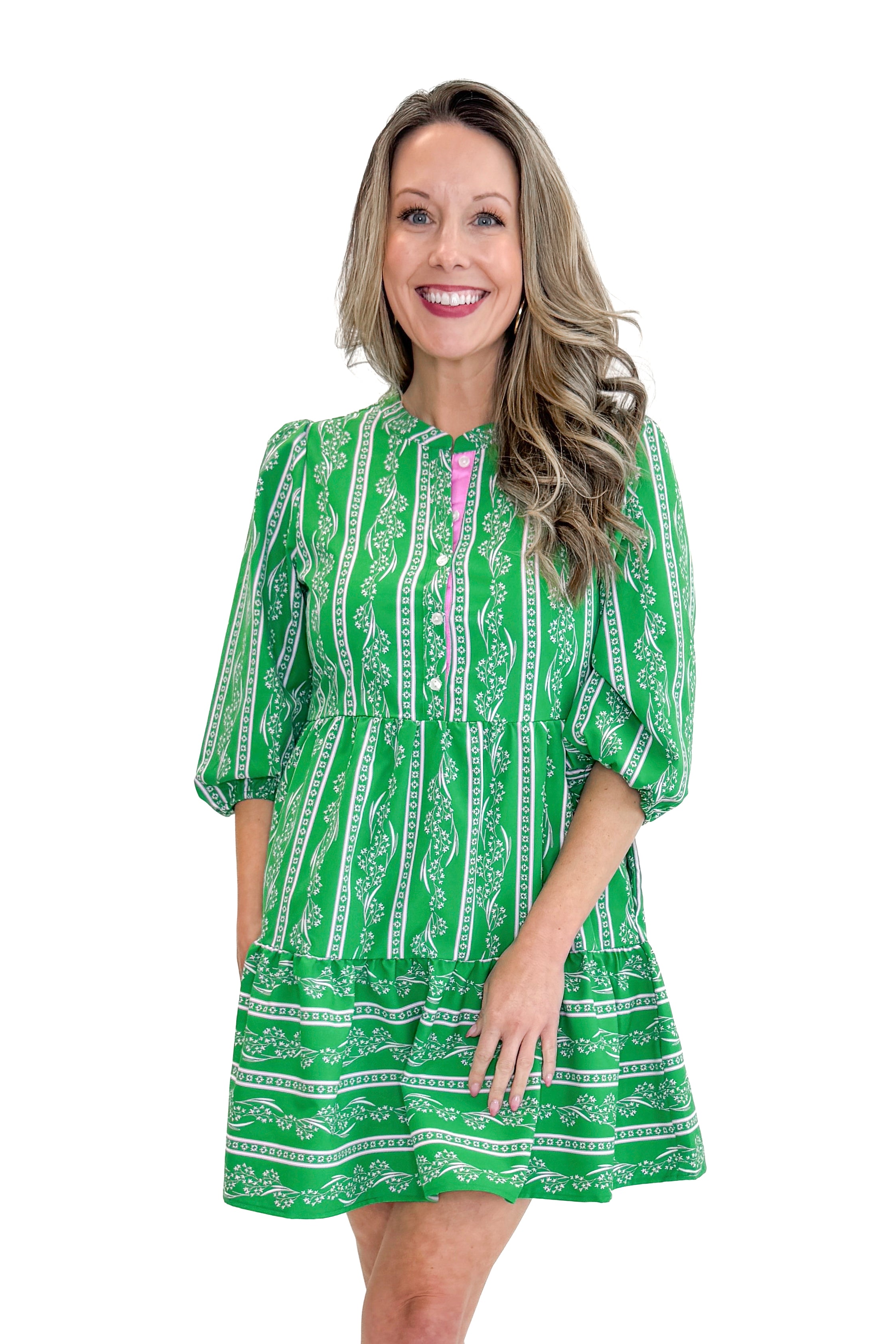 Model wearing Green Garden Lae Riley Mini Dress by Mary Square against white studio background.