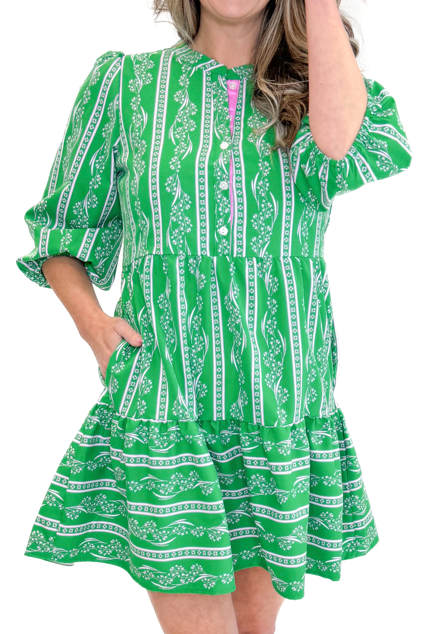 Model wearing Green Garden Lae Riley Mini Dress by Mary Square against white studio background detail view.