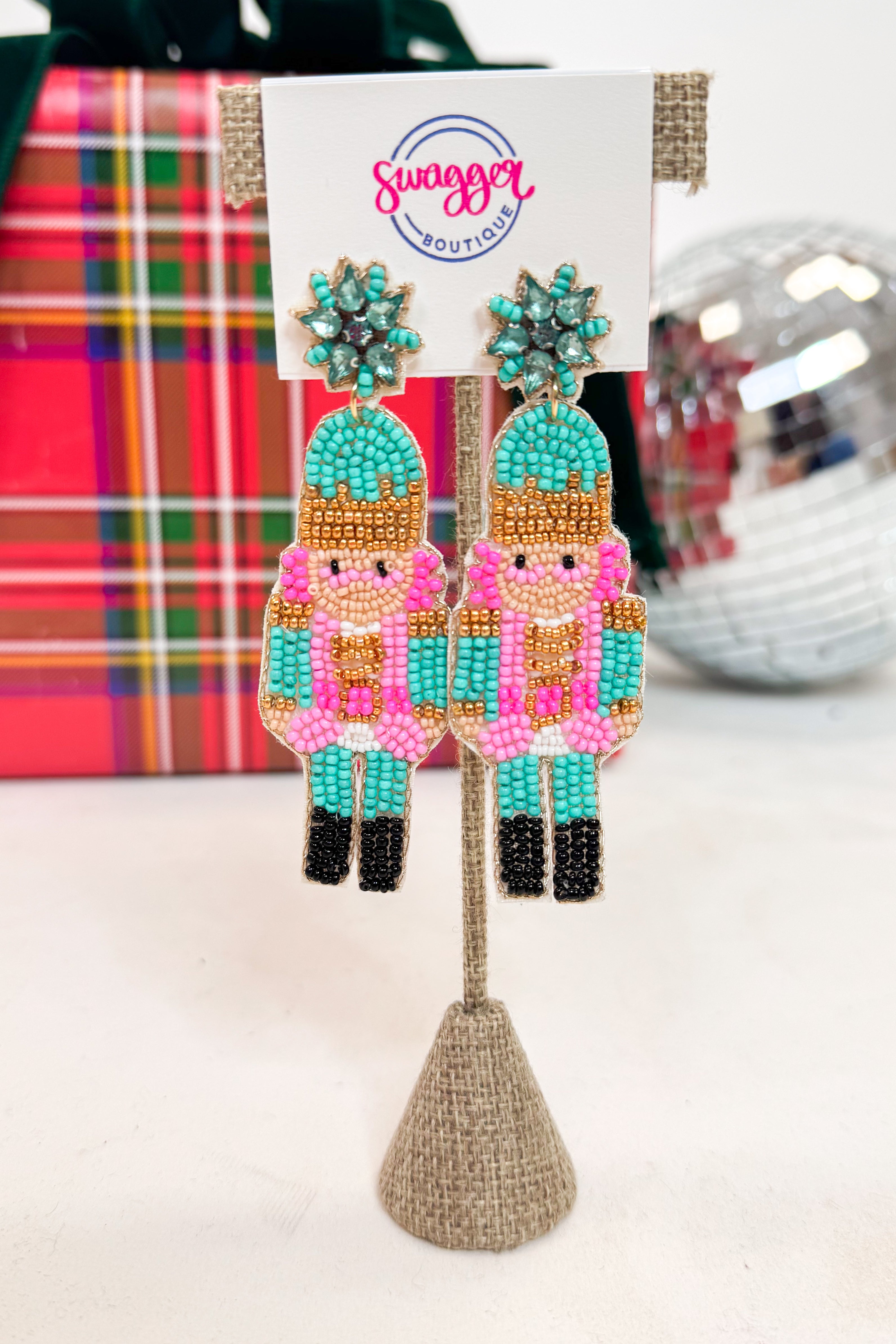 Colorful beaded earrings on a card with &