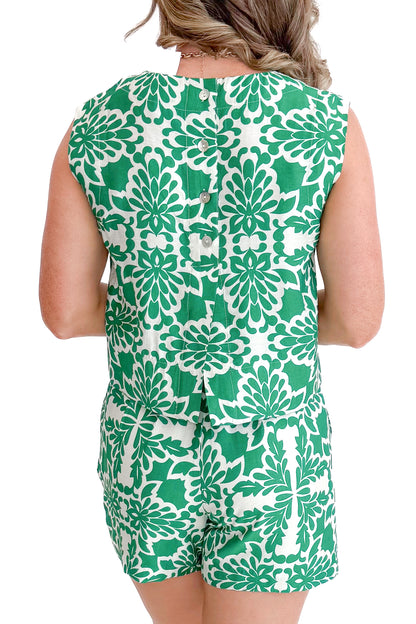 Back view of woman wearing Green &amp; Ivory Printed Shorts by Skies Are Blue with matching tank against a white background.