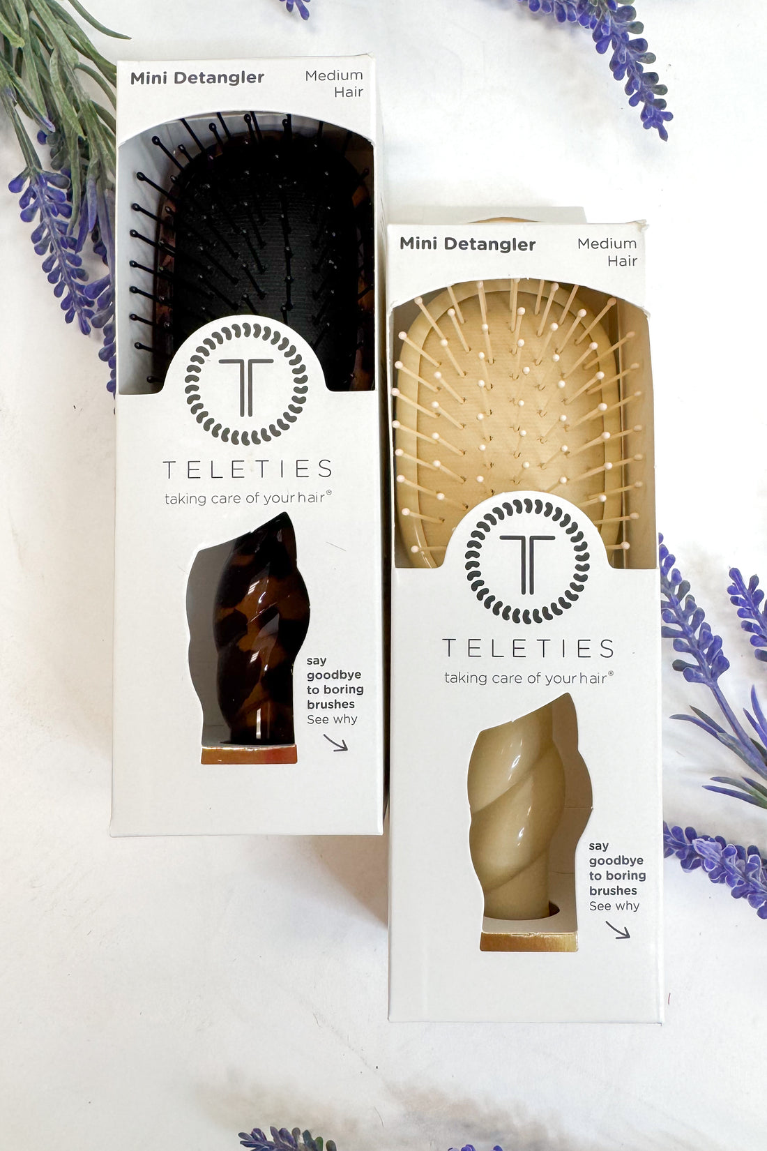 Two Teleties mini detanglers in packaging with lavender flowers in the background