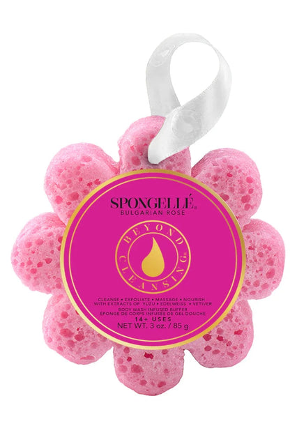 Pink flower-shaped sponge with a label on a white background