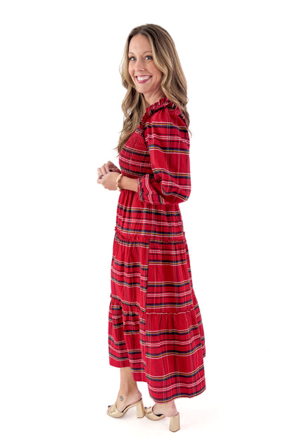 Side view of woman wearing Red Walton Plaid Midi Dress against white studio background.