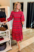 Front view of woman wearing Red Walton Plaid Midi Dress in a boutique.