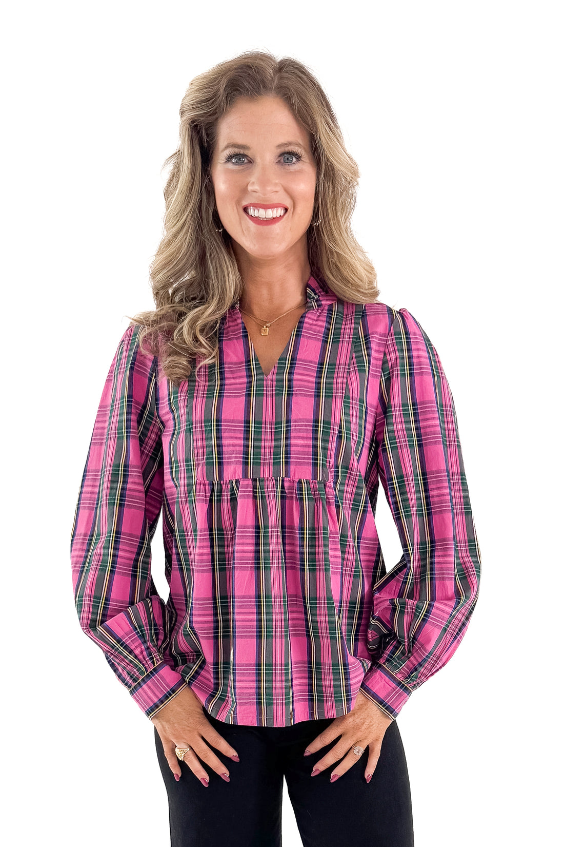 Front view of woman wearing Pink Plaid Mitzy Top with jeans against white studio background.