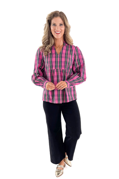 Front view of woman wearing Pink Plaid Mitzy Top with jeans against white studio background.