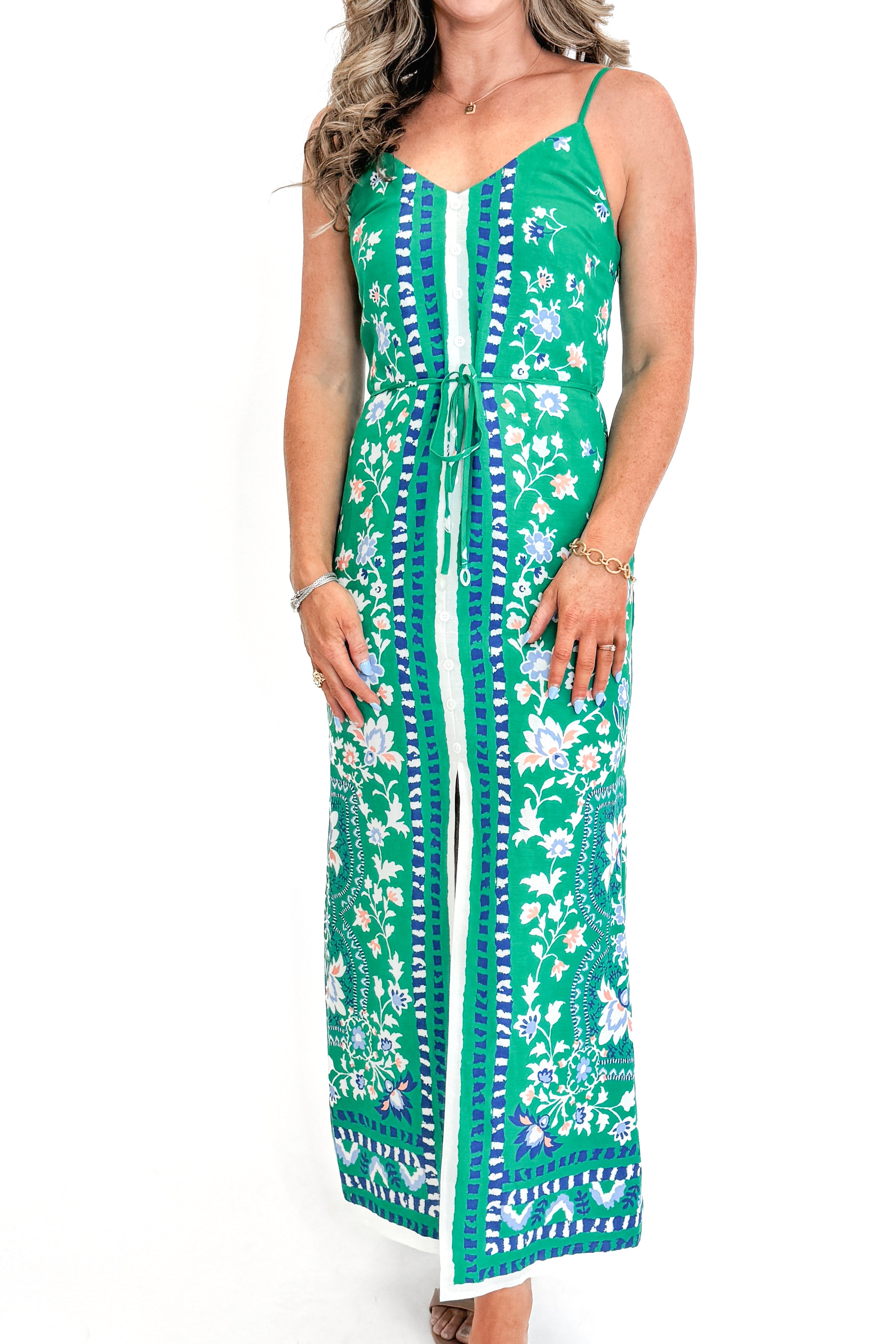 Front view of woman wearing Green Floral Border Print Dress by Skies Are Blue against white studio background.