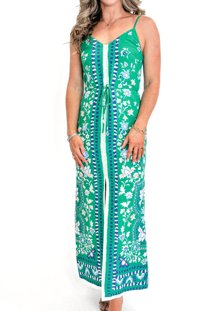 Front view of woman wearing Green Floral Border Print Dress by Skies Are Blue against white studio background.