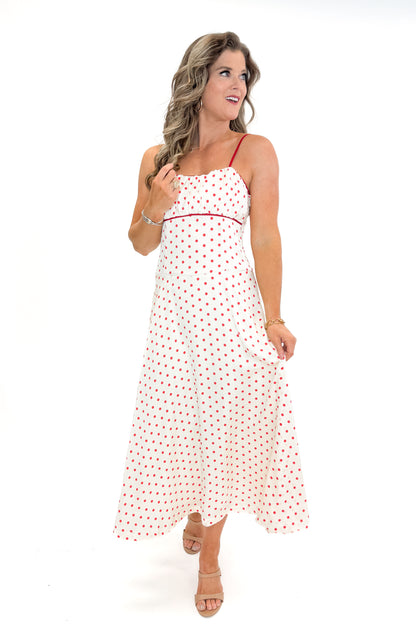 Front view of woman wearing Cream &amp; Red Polka Dot Midi Dress by Skies Are Blue against white studio background.