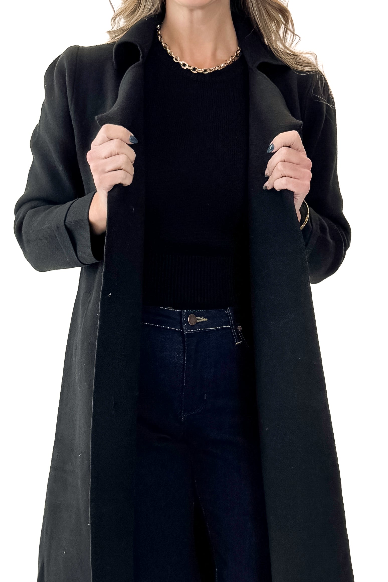 Front view of woman wearing Black Long Peacoat with jeans against white studio background.