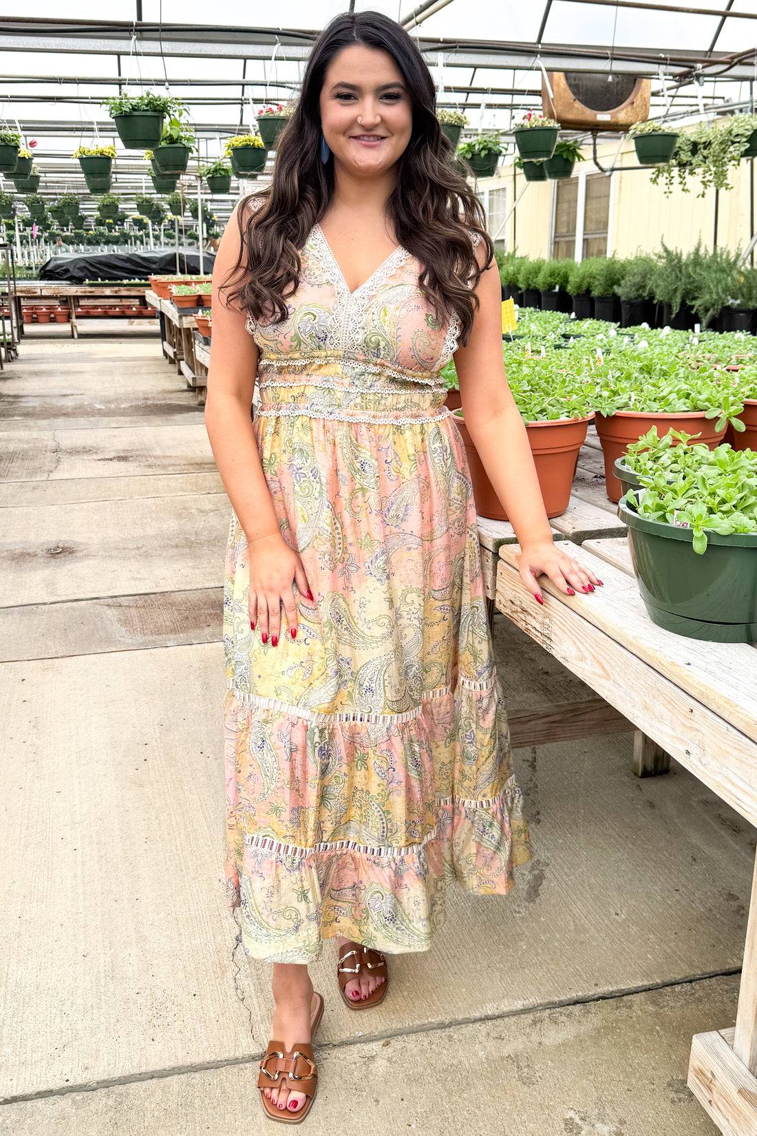 Front view of woman wearing Yellow &amp; Pink Paisley Print Lace Trim Maxi by Skies Are Blue at a garden center.