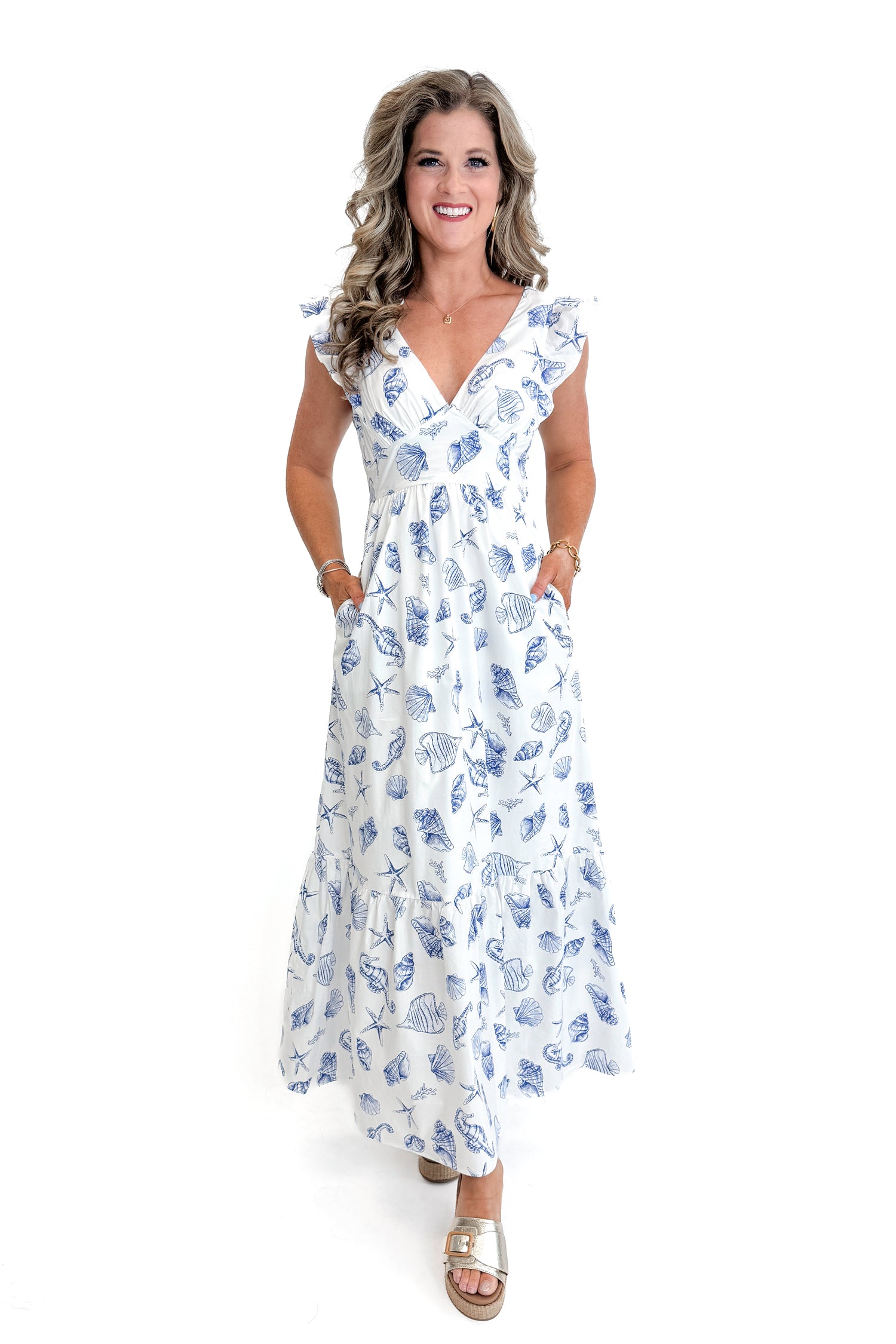 Front view of woman wearing White &amp; Blue Shell Print Tie Back Maxi Dress by Skies Are Blue against white studio background.