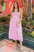 Front view of woman wearing Light Pink Drop Waist Midi Dress by Skies Are Blue  at a restaurant.
