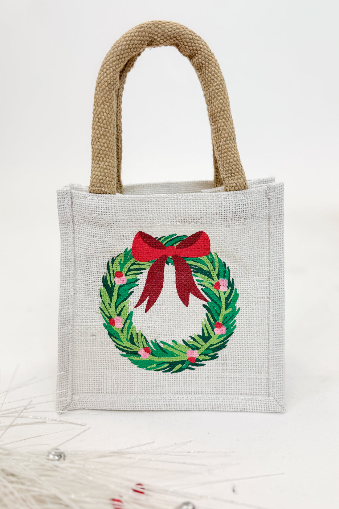 Small tote bag with a Christmas wreath design on a white background