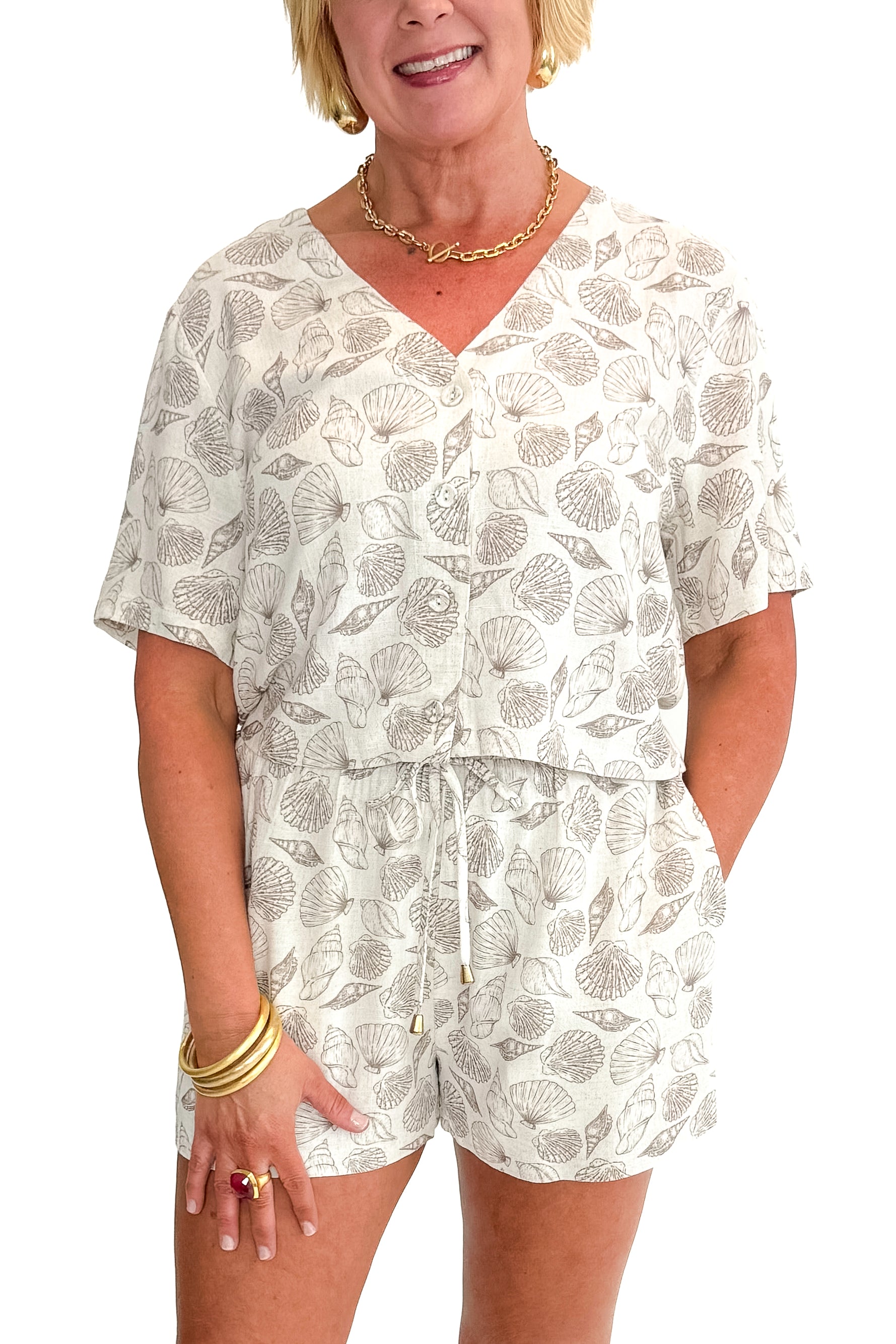 Front view of woman wearing Linen Shell Printed Top with matching shorts against white studio background.