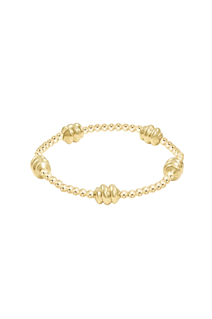Gold bracelet on a white background