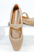 Adora- Natural Raffia Flats against white studio background.