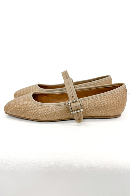 Adora- Natural Raffia Flats against white studio background side view.