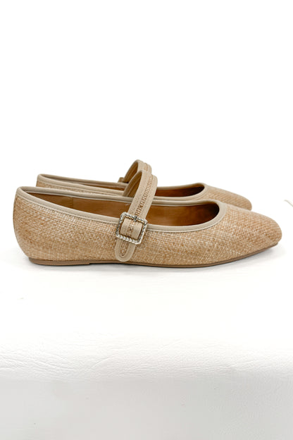 Adora- Natural Raffia Flats against white studio background side view.