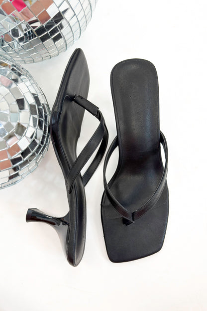 Align- Black Thong Kitten Heels against white studio background.