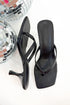 Align- Black Thong Kitten Heels against white studio background.