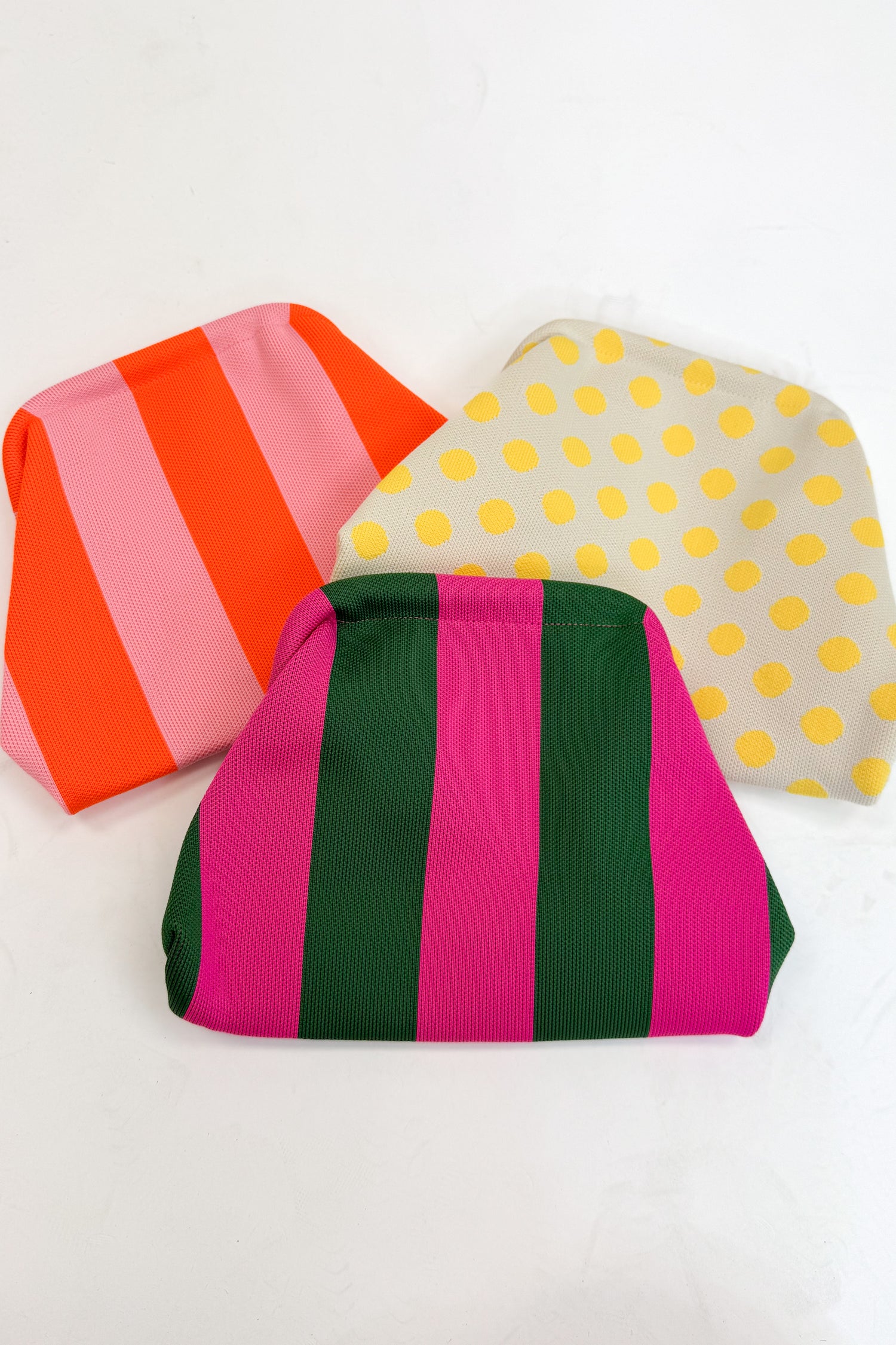 Three colorful pouches with different patterns on a white background