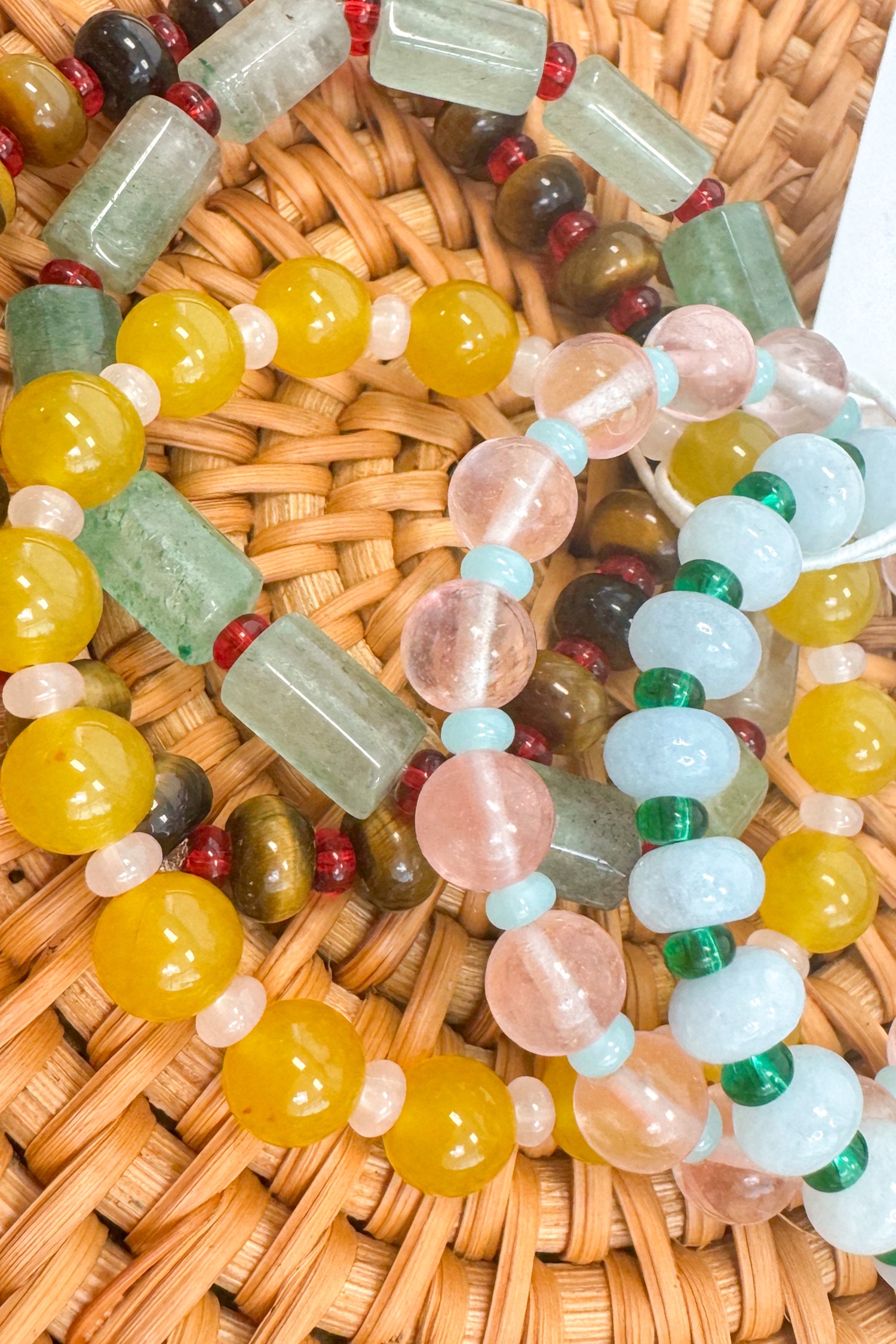 Colorful beaded bracelet on a woven surface