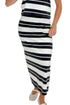 Front detail view of woman wearing Swagger Boutique’s Ash Black Stellan Striped Tee by Z Supply with Ash Black Gail Striped Jersey Midi Skirt by Z Supply against white studio background.