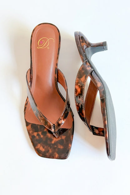 Azalea- Tortoise Thong Kitten Heel against white studio background