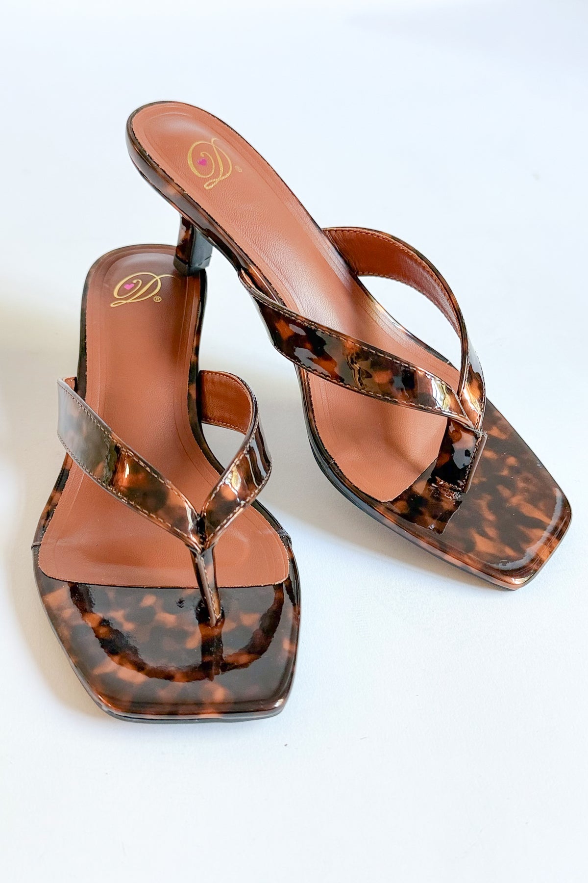 Azalea- Tortoise Thong Kitten Heel against white studio background