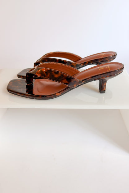 Azalea- Tortoise Thong Kitten Heel against white studio background side view