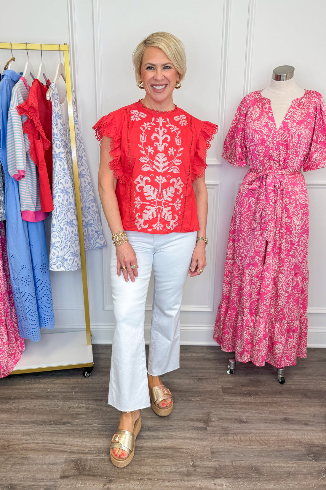 Front view of wearing Tomato Embroidered Flutter Sleeve Top by Fate with white jeans and sandals.