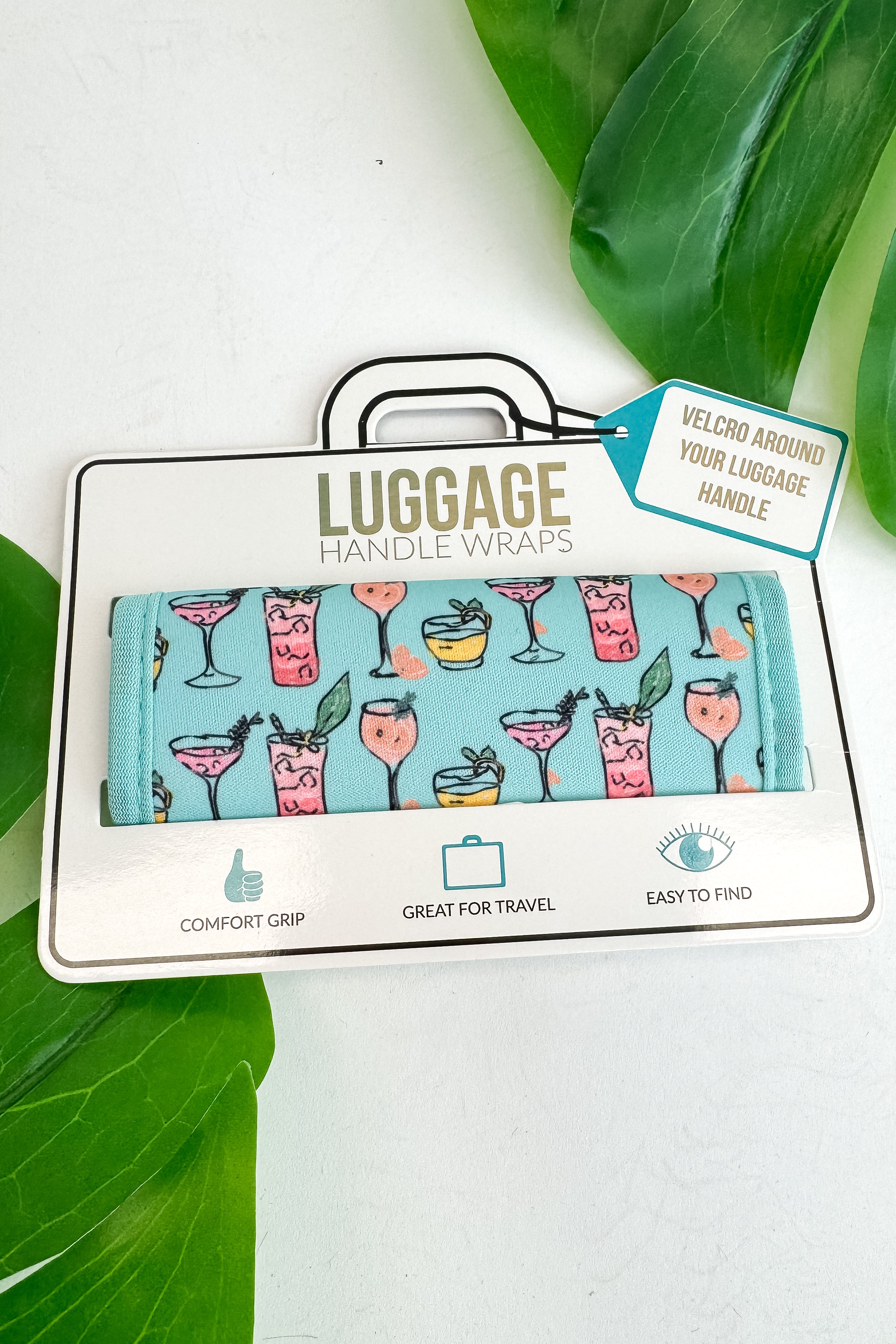 Luggage handle wrap with cocktail design packaging on a white background