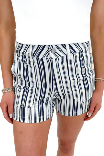 Front detail view of woman wearing Navy Striped Cargo Shorts by Just Black Denim with tank against white studio background.