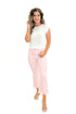 Front view of woman wearing Pink Striped Crop Flare Jeans by Just Black Denim with white top against white studio background.