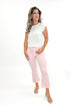 Front view of woman wearing Pink Striped Crop Flare Jeans by Just Black Denim with white top against white studio background.