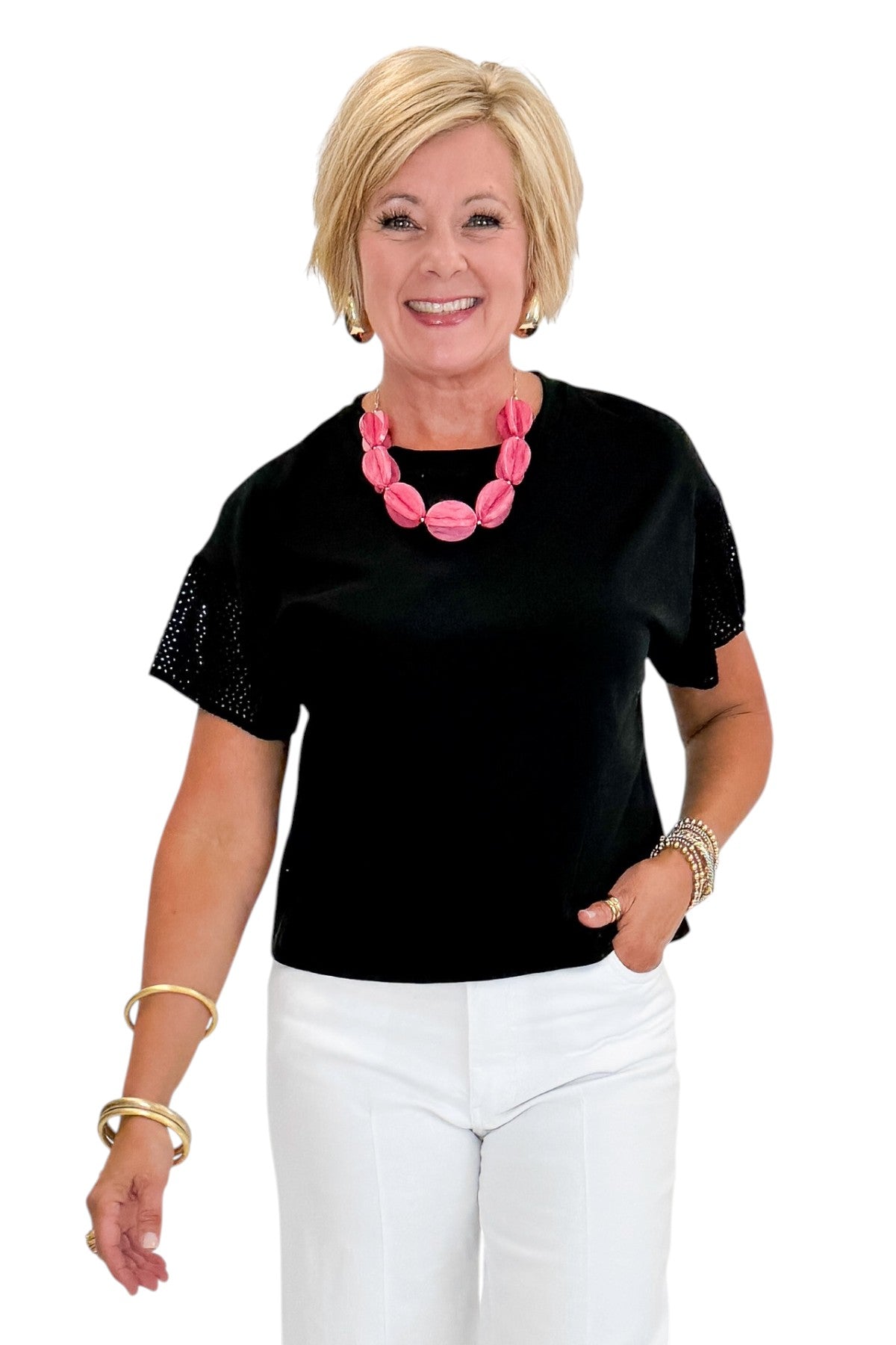 Front view of woman wearing Swagger Boutique’s Black Banyan Top by Z Supply with jeans against white studio background.