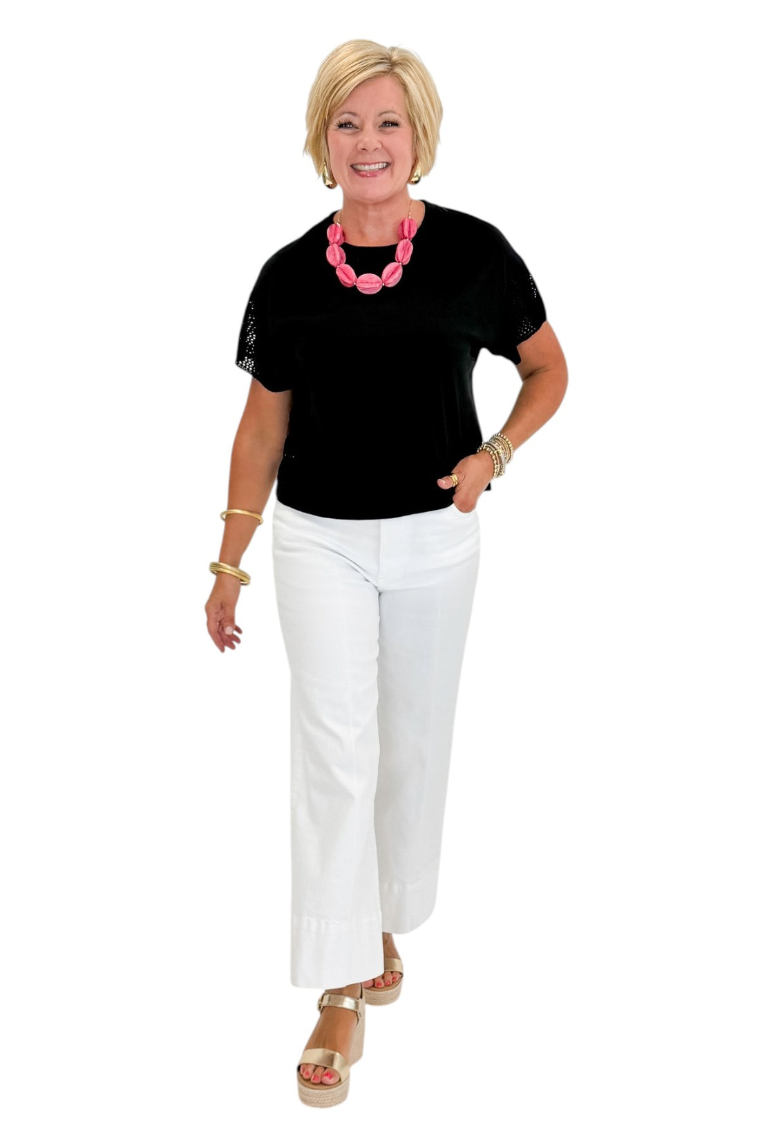 Front view of woman wearing Swagger Boutique’s Black Banyan Top by Z Supply with jeans against white studio background.